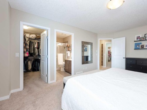 14 Walden Road Se, Calgary, AB - Indoor Photo Showing Bedroom