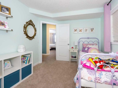 14 Walden Road Se, Calgary, AB - Indoor Photo Showing Bedroom