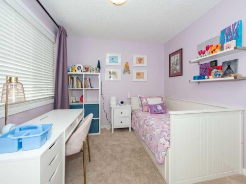 14 Walden Road Se, Calgary, AB - Indoor Photo Showing Bedroom