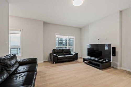 611-20295 Seton Way Se, Calgary, AB - Indoor Photo Showing Living Room