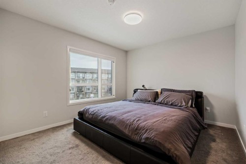 611-20295 Seton Way Se, Calgary, AB - Indoor Photo Showing Bedroom