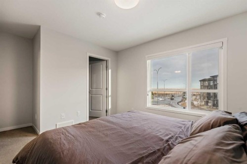 611-20295 Seton Way Se, Calgary, AB - Indoor Photo Showing Bedroom