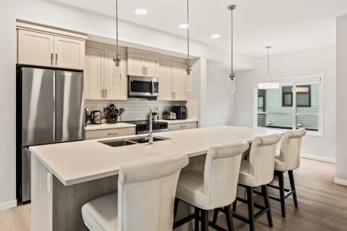 611-20295 Seton Way Se, Calgary, AB - Indoor Photo Showing Kitchen With Stainless Steel Kitchen With Double Sink With Upgraded Kitchen