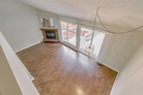 9-2225 Oakmoor Drive Sw, Calgary, AB - Indoor With Fireplace