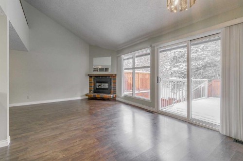 9-2225 Oakmoor Drive Sw, Calgary, AB - Indoor With Fireplace
