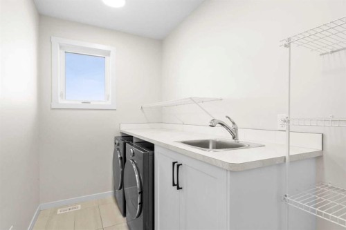 1104 Cranbrook Gardens Se, Calgary, AB - Indoor Photo Showing Laundry Room
