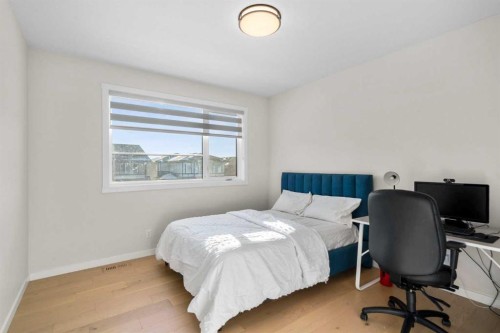 1104 Cranbrook Gardens Se, Calgary, AB - Indoor Photo Showing Bedroom