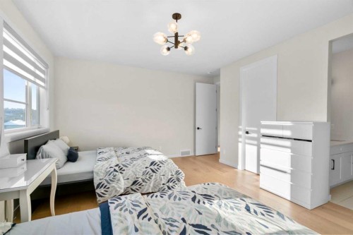 1104 Cranbrook Gardens Se, Calgary, AB - Indoor Photo Showing Bedroom
