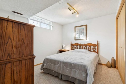 181 Woodford Drive Sw, Calgary, AB - Indoor Photo Showing Bedroom