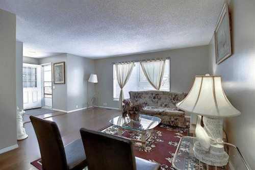 164 Faldale Close Ne, Calgary, AB - Indoor Photo Showing Living Room