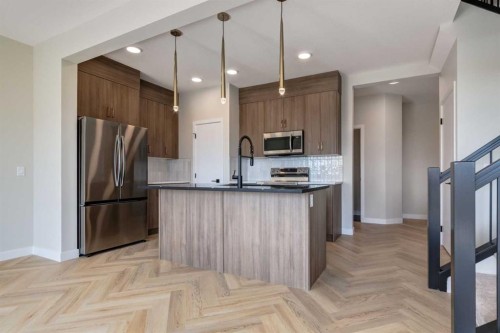 86 Agate Road, Cochrane, AB - Indoor Photo Showing Kitchen