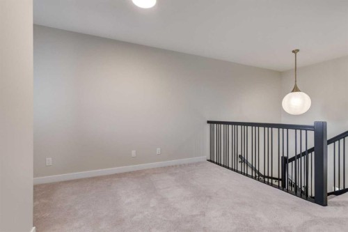 86 Agate Road, Cochrane, AB - Indoor Photo Showing Other Room