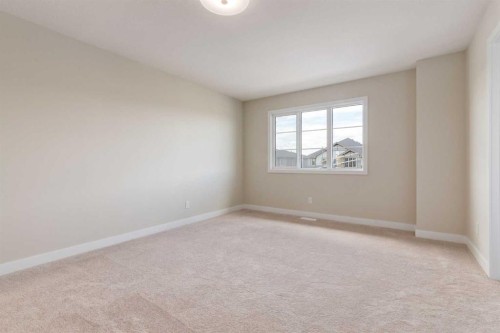 86 Agate Road, Cochrane, AB - Indoor Photo Showing Other Room