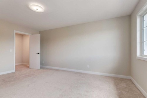 86 Agate Road, Cochrane, AB - Indoor Photo Showing Other Room