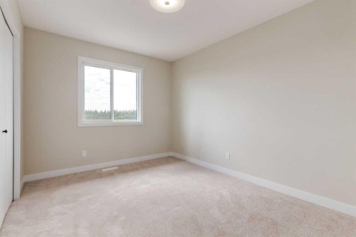 86 Agate Road, Cochrane, AB - Indoor Photo Showing Other Room