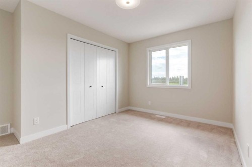 86 Agate Road, Cochrane, AB - Indoor Photo Showing Other Room