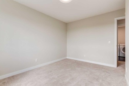 86 Agate Road, Cochrane, AB - Indoor Photo Showing Other Room