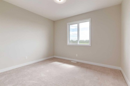 86 Agate Road, Cochrane, AB - Indoor Photo Showing Other Room
