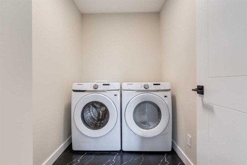 86 Agate Road, Cochrane, AB - Indoor Photo Showing Laundry Room