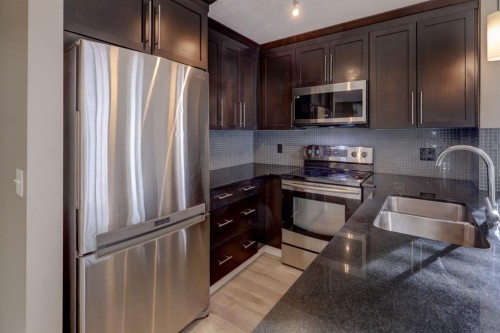 1311-155 Skyview Ranch Way Ne, Calgary, AB - Indoor Photo Showing Kitchen With Stainless Steel Kitchen With Double Sink With Upgraded Kitchen