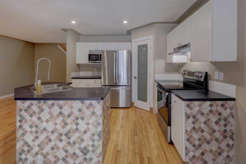 11065 Hidden Valley Drive Nw, Calgary, AB - Indoor Photo Showing Kitchen With Double Sink