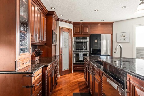 25 Mckinley Bay Se, Calgary, AB - Indoor Photo Showing Kitchen With Upgraded Kitchen