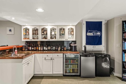 25 Mckinley Bay Se, Calgary, AB - Indoor Photo Showing Kitchen With Double Sink