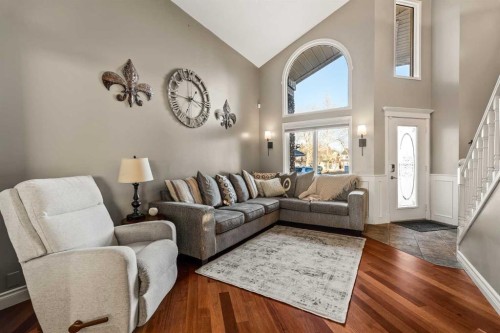 25 Mckinley Bay Se, Calgary, AB - Indoor Photo Showing Living Room