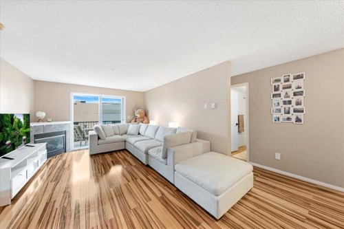 4214-4975 130 Avenue Se, Calgary, AB - Indoor Photo Showing Living Room With Fireplace