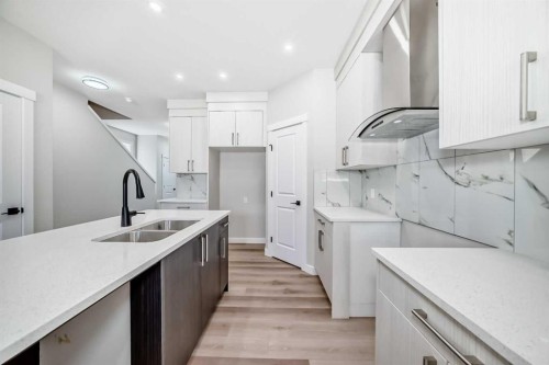 112 Belvedere Park Se, Calgary, AB - Indoor Photo Showing Kitchen With Double Sink
