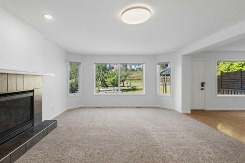 432 Royal Oak Circle Nw, Calgary, AB - Indoor Photo Showing Living Room With Fireplace