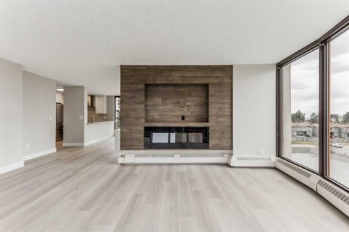 351-7030 Coach Hill Road Sw, Calgary, AB - Indoor Photo Showing Living Room With Fireplace