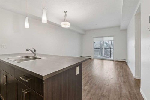 9211-101 Sunset Drive, Cochrane, AB - Indoor Photo Showing Kitchen With Double Sink