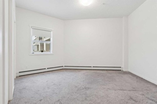 9211-101 Sunset Drive, Cochrane, AB - Indoor Photo Showing Other Room