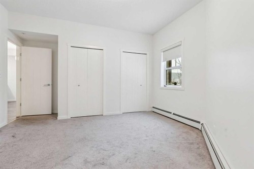 9211-101 Sunset Drive, Cochrane, AB - Indoor Photo Showing Other Room