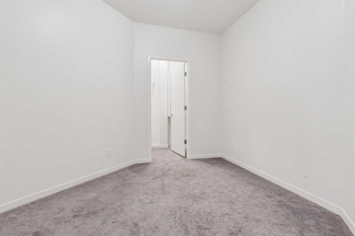 9211-101 Sunset Drive, Cochrane, AB - Indoor Photo Showing Other Room