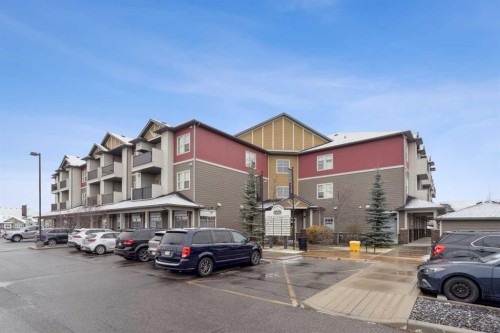 9211-101 Sunset Drive, Cochrane, AB - Outdoor With Balcony With Facade