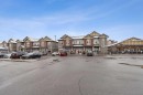 9211-101 Sunset Drive, Cochrane, AB  - Outdoor With Facade 