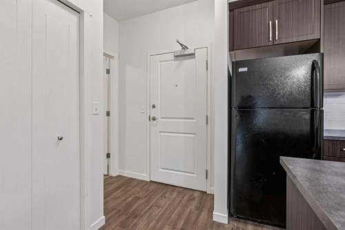 9211-101 Sunset Drive, Cochrane, AB - Indoor Photo Showing Other Room
