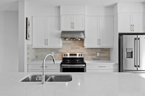 75 Sage Meadows Circle Nw, Calgary, AB - Indoor Photo Showing Kitchen With Stainless Steel Kitchen With Double Sink With Upgraded Kitchen