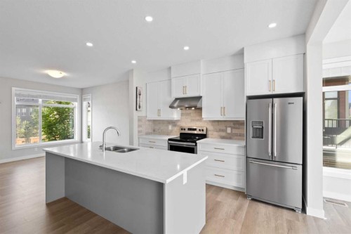 75 Sage Meadows Circle Nw, Calgary, AB - Indoor Photo Showing Kitchen With Stainless Steel Kitchen With Double Sink With Upgraded Kitchen