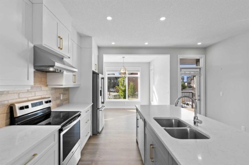 75 Sage Meadows Circle Nw, Calgary, AB - Indoor Photo Showing Kitchen With Stainless Steel Kitchen With Double Sink With Upgraded Kitchen