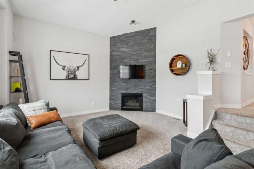 157 Chaparral Court Se, Calgary, AB - Indoor Photo Showing Living Room With Fireplace