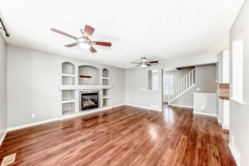 340 Morningside Crescent Sw, Airdrie, AB - Indoor Photo Showing Other Room With Fireplace
