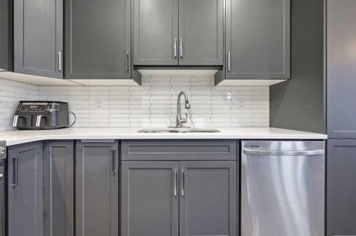 9 Osborne Link, Airdrie, AB - Indoor Photo Showing Kitchen With Double Sink With Upgraded Kitchen