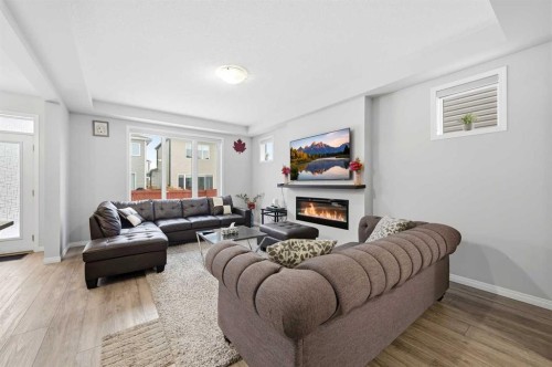 9 Osborne Link, Airdrie, AB - Indoor Photo Showing Living Room With Fireplace