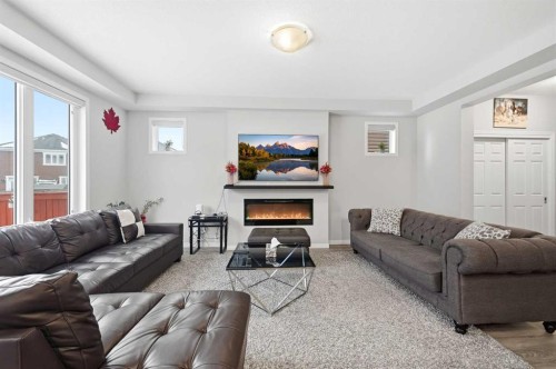 9 Osborne Link, Airdrie, AB - Indoor Photo Showing Living Room With Fireplace