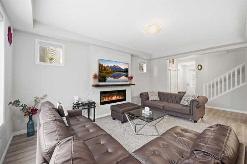 9 Osborne Link, Airdrie, AB - Indoor Photo Showing Living Room With Fireplace