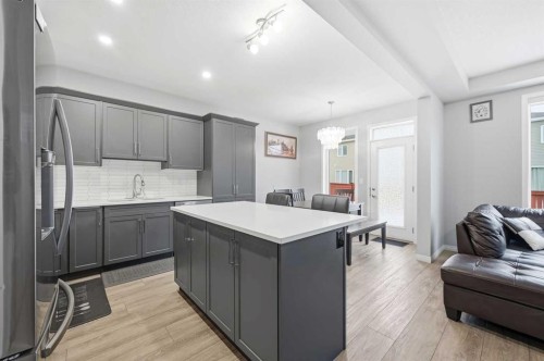 9 Osborne Link, Airdrie, AB - Indoor Photo Showing Kitchen With Upgraded Kitchen