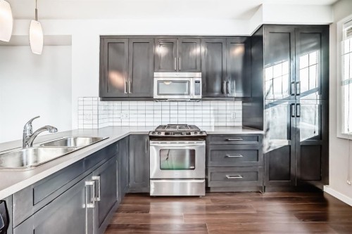 35 Nolan Hill Boulevard, Calgary, AB - Indoor Photo Showing Kitchen With Double Sink With Upgraded Kitchen